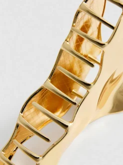 Abstrakte Haarklammer in Metallic-Optik