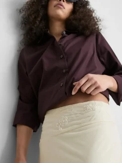 Asymmetrischer Midirock mit Perlen