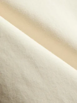Ein Bandeau-Top mit spitzem Saum