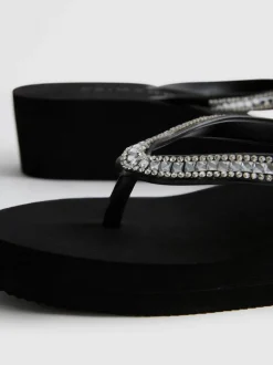 Flipflops mit Keilabsatz und Strasssteinen