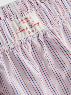Gestreifte Baumwoll-Schlafshorts mit Room Service-Print