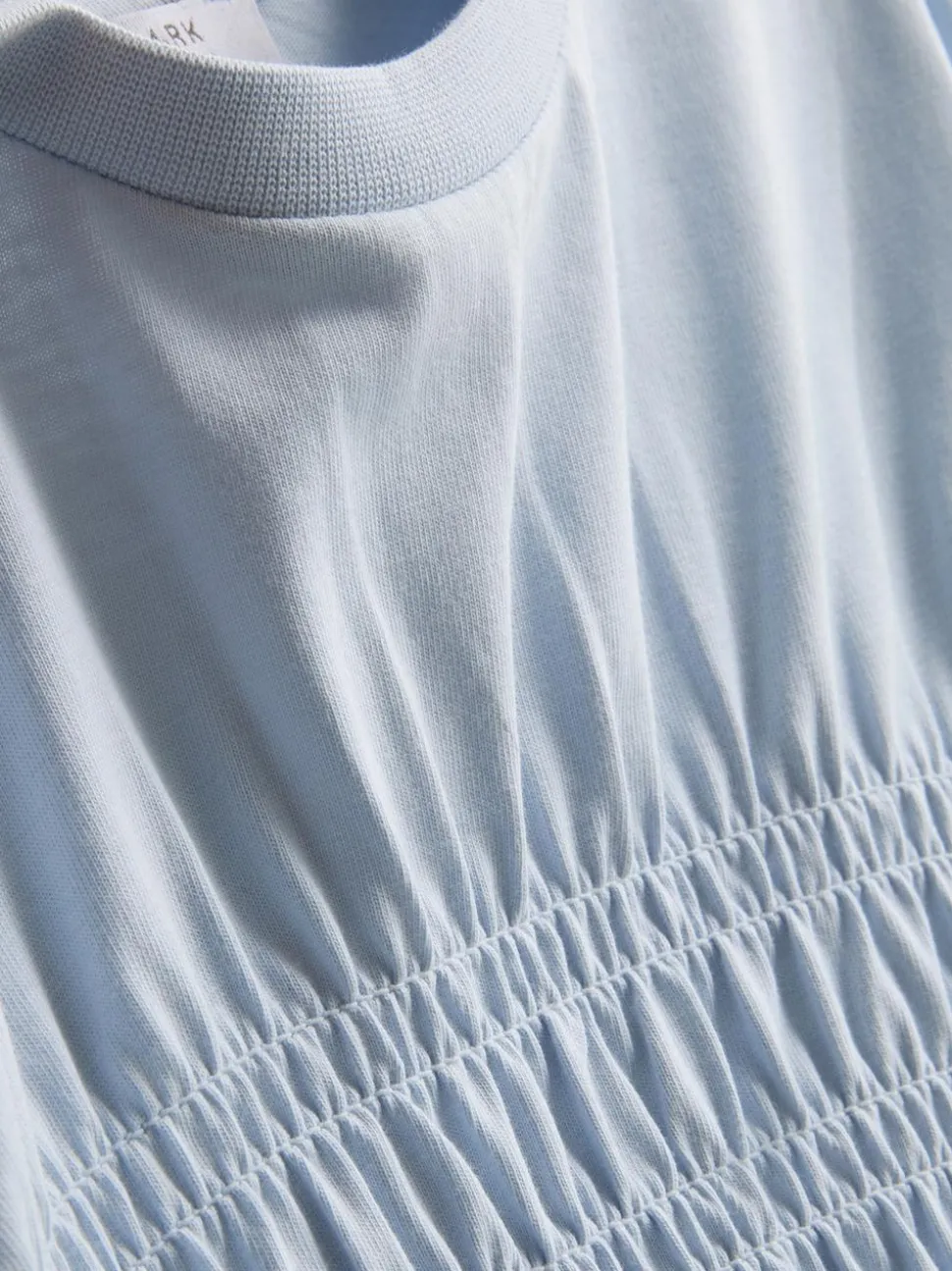 7–15 Jahre | Gesmoktes T-Shirt mit Schößchen