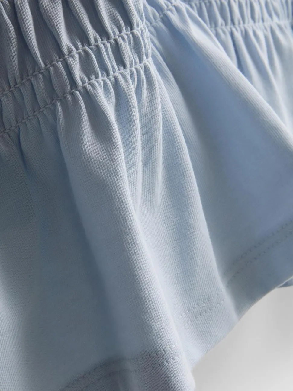 7–15 Jahre | Gesmoktes T-Shirt mit Schößchen
