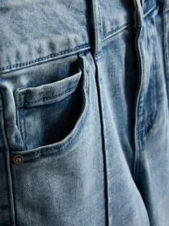 7–15 Jahre | Jeans mit ausgestelltem Bein und Biesen