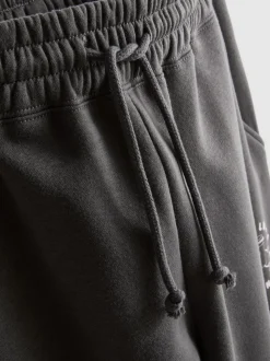 Jogginghose aus Baumwollmischung mit Bündchen und Print