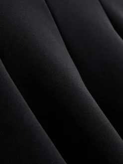 Krepp-Top mit Herzausschnitt und Schößchen