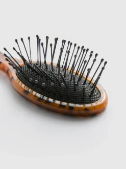 Mini-Reisepaddelbürste mit Animalprint