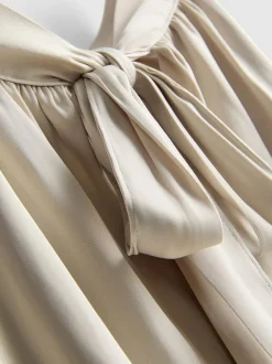 Neckholder-Bluse mit Ballonsaum