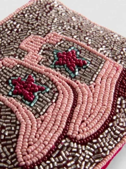 Perlenbesetzte Tasche mit Westernstiefeln