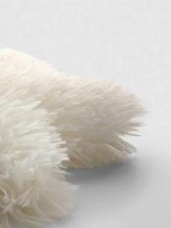 Sternförmiges Kissen im Pompon-Stil