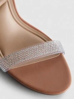 Transparente Sandaletten mit Strasssteinen