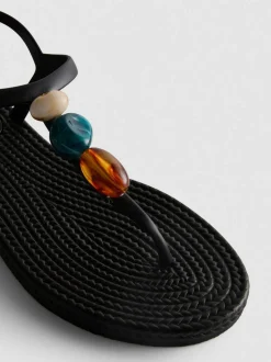 Zehenstegsandalen mit Perlen